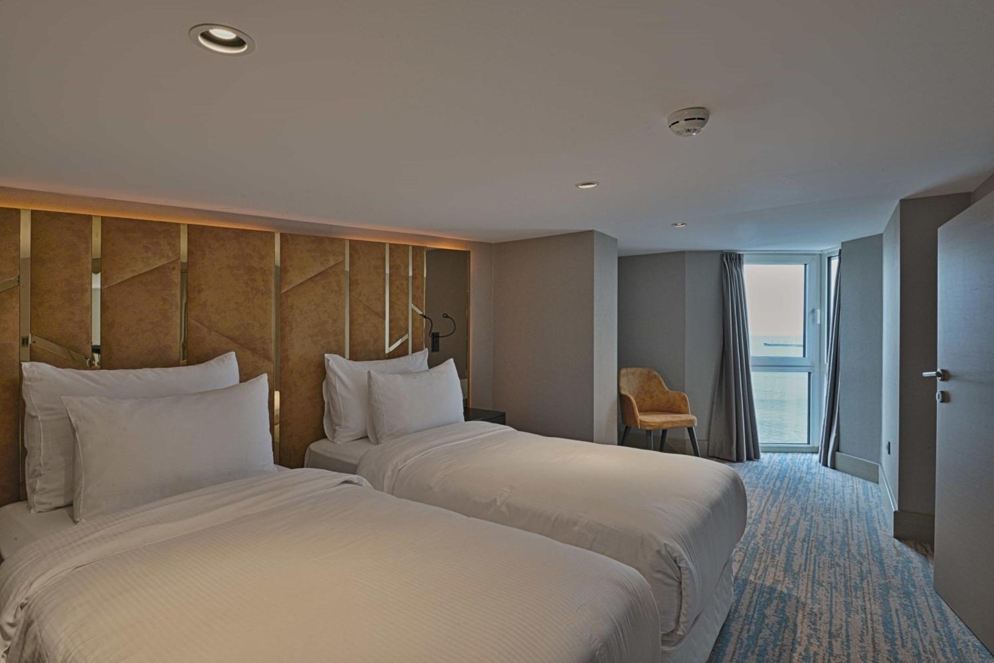 Duplex Suite One Queen Bed Two Single Beds Balcony View