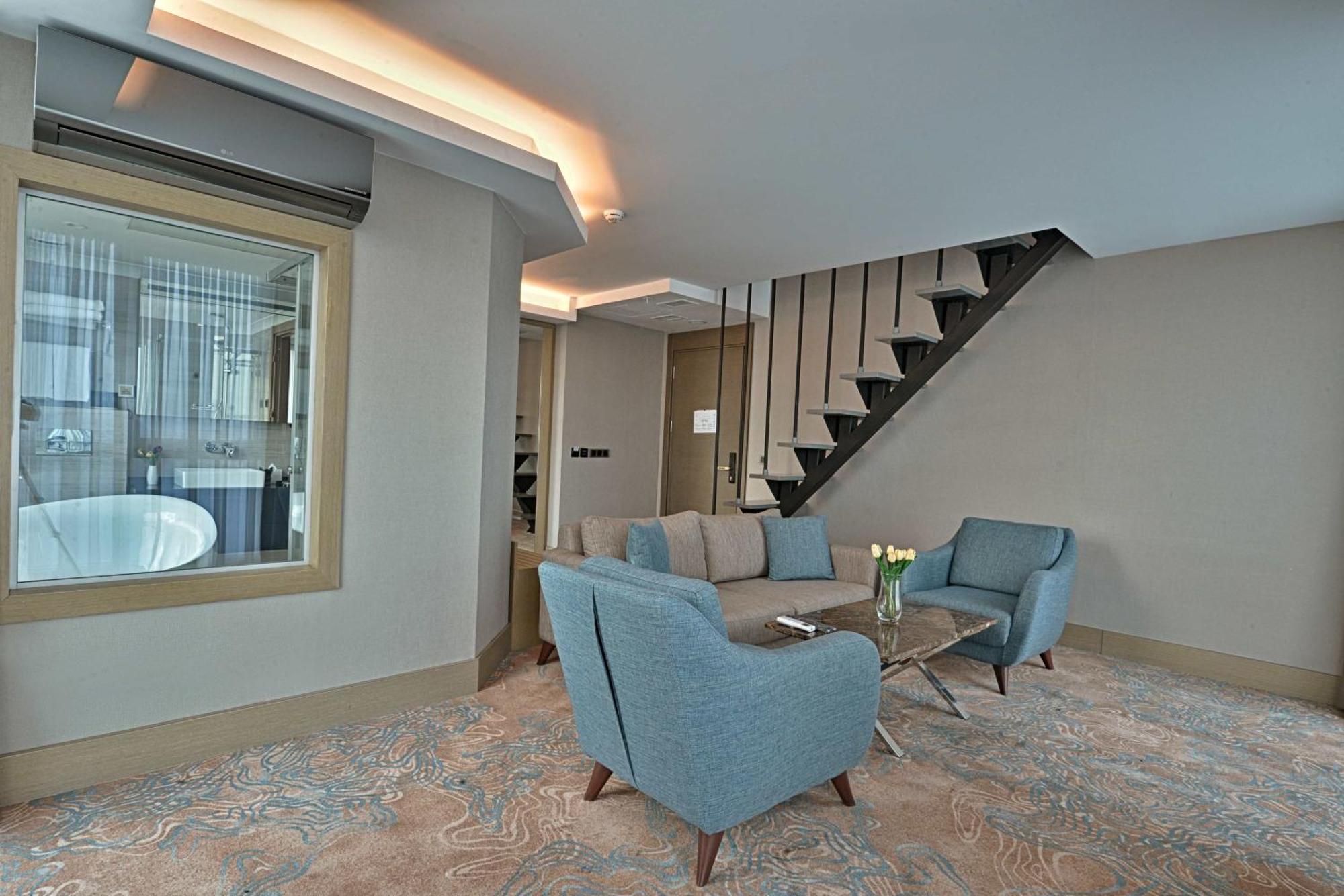 Duplex Suite One Queen Bed Two Single Beds Balcony View